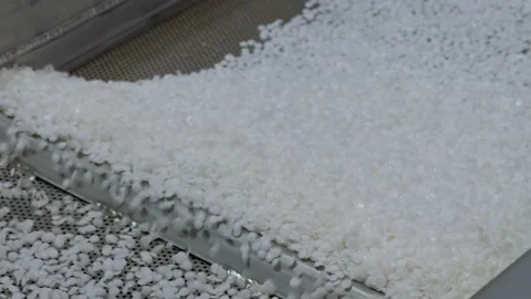 Close up: recycled plastic granules on automatic shale shaker, conveyor belt Stock Footage 160222854