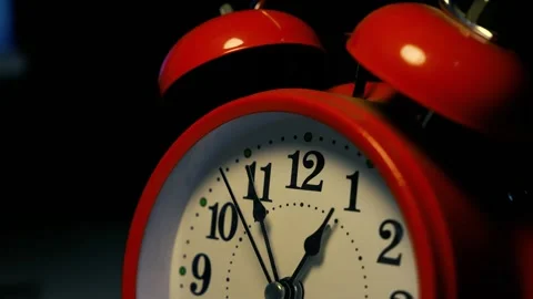 Close-up of a red alarm clock at midnight shot Stock Footage 321936972