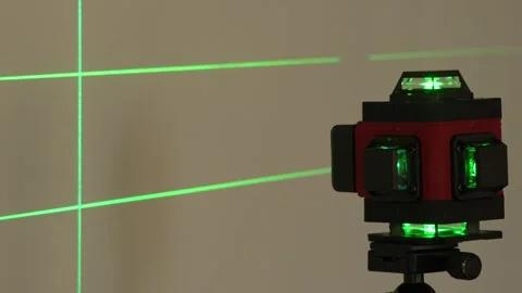 Close-up of a red and black laser level mounted on a tripod Stock Footage 341702496