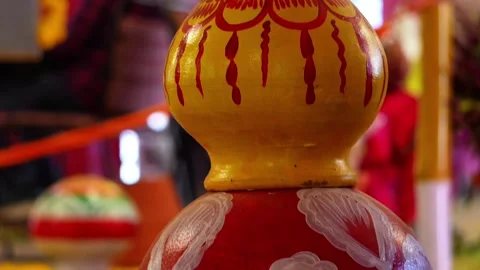 Close-up of red and orange decorated earthen pot with golden patterns, trad.. Stock Footage 346729866