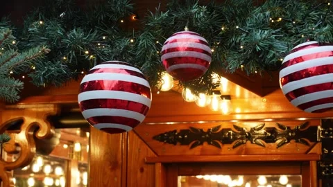 Close-up of red and white striped Christmas ornaments hanging Stock Footage 296199750