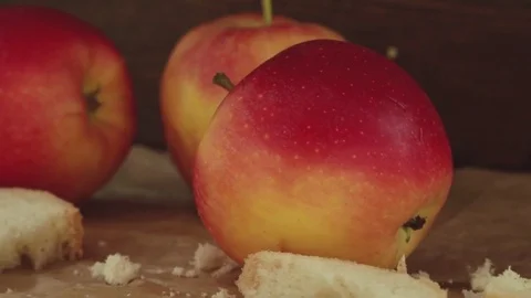 Close up of red apples and bread crumbs Stock Footage 80350730
