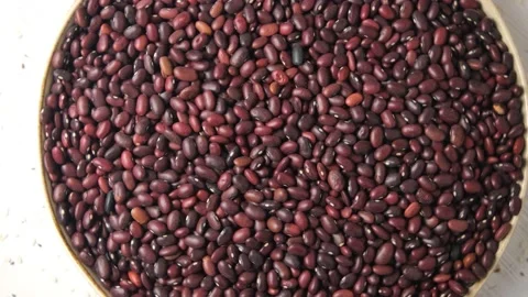 Close-up of red beans scattered on the table. High-protein legumes, beans and le Stock Footage 147871681