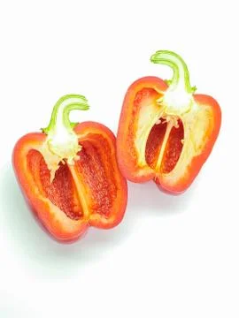 Close-up of red bell pepper cut in half, inside with seeds isolated on white Stock Photos