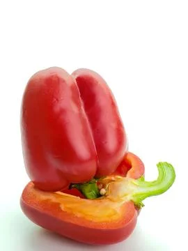 Close-up of red bell pepper cut in half, inside with seeds isolated on white Stock Photos