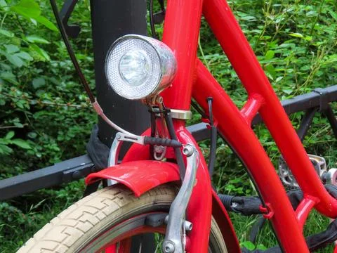 Close-up of a red bicycle front light and brake system Stock Photos