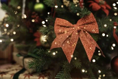 Close-up red bow on Christmas tree. Stock Photos