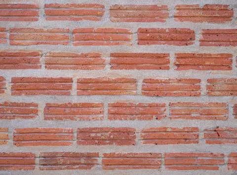 Close-up of the red brick wall background. Exterior design texture. Stock Photos