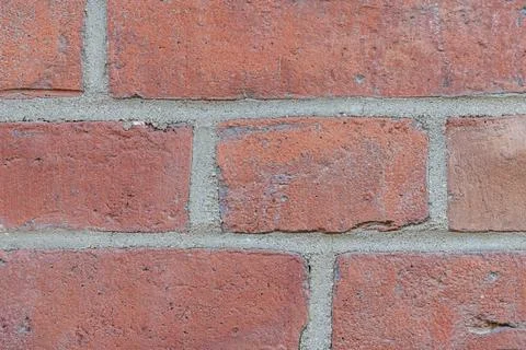 Close-up of red brick wall with gray mortar detail Fotos de archivo