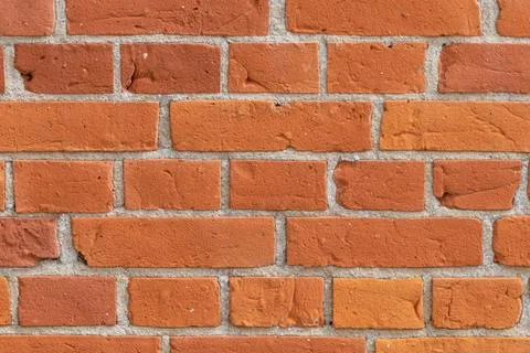 Close-up of a red brick wall. rough, aged bricks. Background and texture Stock Photos