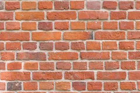 Close-up of a red brick wall. rough, aged bricks. Background and texture Stock Photos