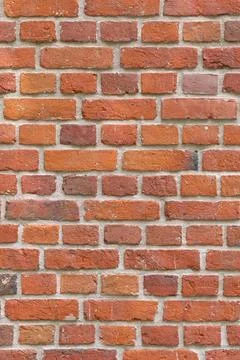 Close-up of a red brick wall. rough, aged bricks. Background and texture Stock Photos
