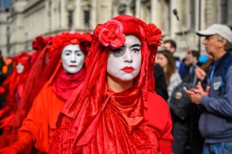 Close up of Red Brigade protesters at an Extinction Rebellion protest march Stock Photos