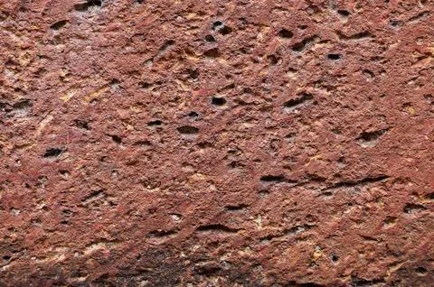 Close up of Red brown rock texture. Background stone scene stone wall  Stock Photos