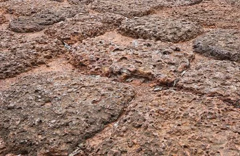 Close up of Red brown rock texture. Brown ground surface. Stock Photos