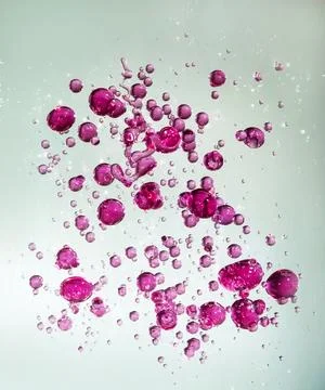 Close up of red bubbles on illuminated background Stock Photos