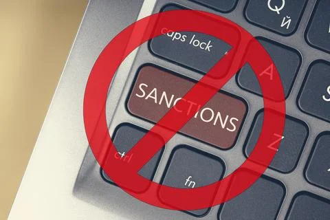 Close-up of the red button with the text of the sanction on the conceptual Stock-Fotos