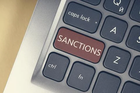 Close-up of the red button with the text of the sanction on the conceptual Stock Photos