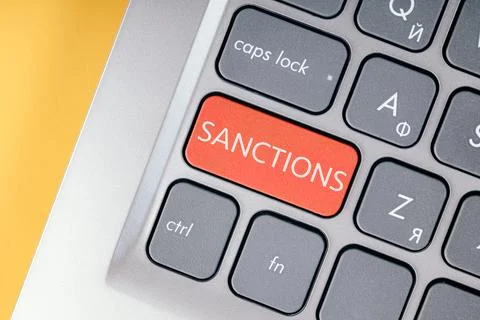 Close-up of the red button with the text of the sanction on the conceptual Stock Photos