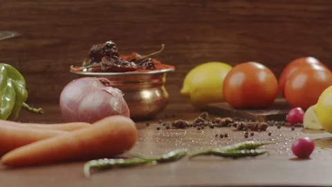 Close-up red cabbage drops on the kitchen table with spray in slow motion Stock Footage 124957578
