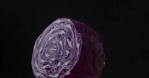 Close-up of red cabbage rotate on dark background. Stock Footage 154425546