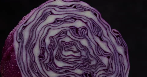 Close-up of red cabbage rotate on dark background. Stock Footage 154954576