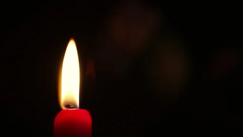 Close-Up of Red Candle Flickering in Darkness Stock Footage 337053196
