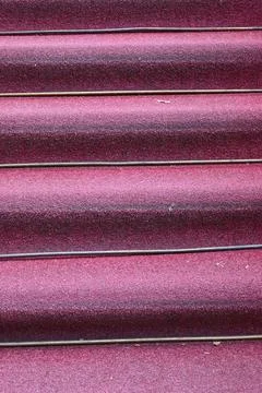 Close-up of red carpeted stairs 스톡 사진