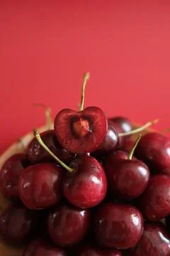 Close-up of red cherries on red background Stock Photos