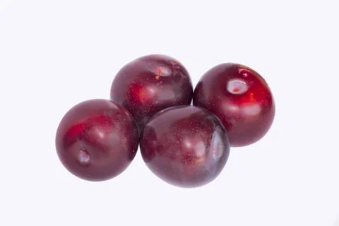 Close up of red cherry plums isolated Stock Photos