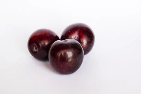 Close up of red cherry plums isolated Stock Photos