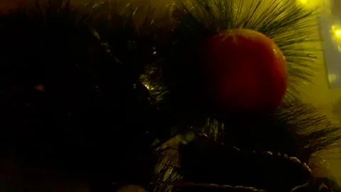 Close-up of a red Christmas ball with a snowflake and pine cone pattern on the Stock Footage 346717976