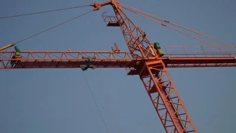 Close up of red construction crane pulley on blue sky Stock Footage 280270043