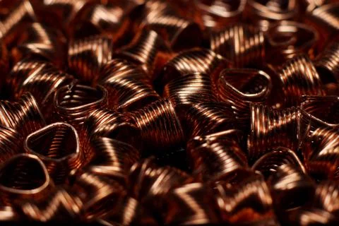 Close-up of red copper spirals with sparkles Stock Photos