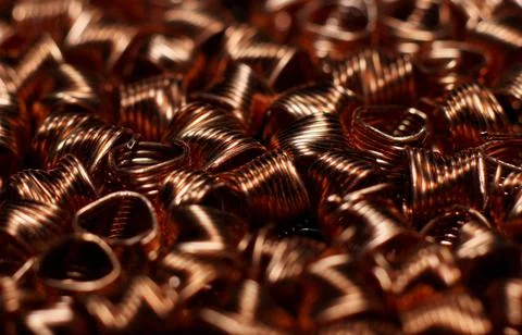 Close-up of red copper spirals with sparkles Stock Photos