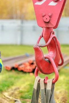 Close-Up of Red Crane Hook with Lifting Straps Stock Photos