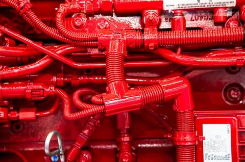 A close up of a red engine with red pipes Stock Photos