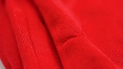 Close up of red fabric with frayed thread and textile texture detail Stock Footage 331695206