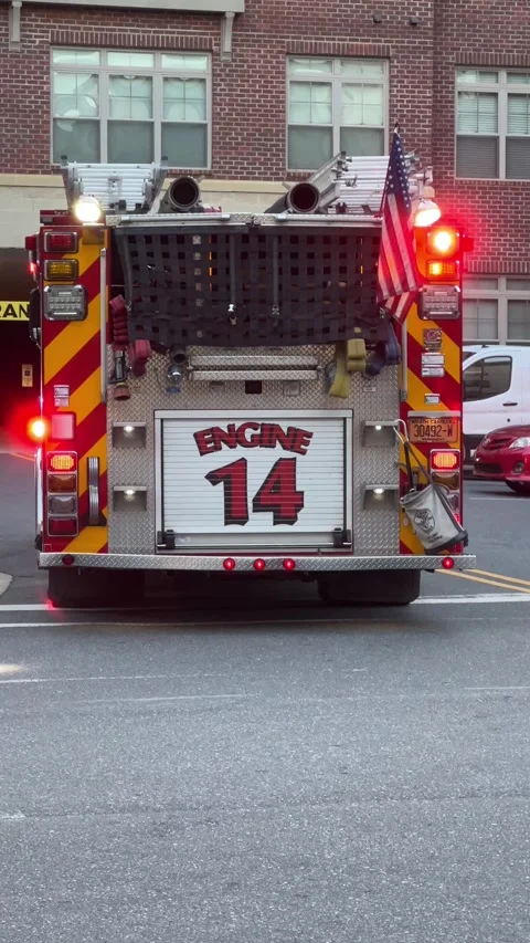 Close up of a red fire engine and rescue truck with flashing lights Stock Footage 311664693