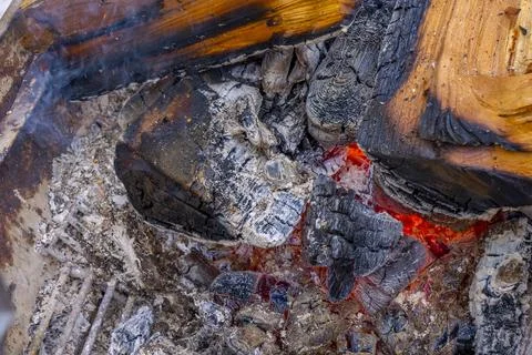 Close up of a red fire flame on a burning firewood tree. Warm winter evening  Stock Photos