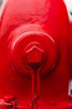 Close-up of red fire hydrant on city street Stock Photos