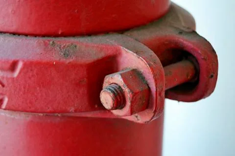 Close up of red fire hydrant in corporate building parking structure 스톡 사진