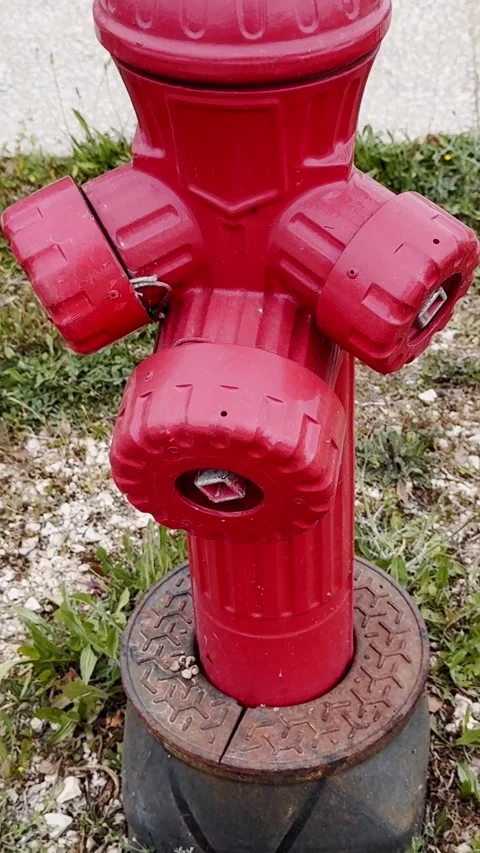 Close-up of a red fire hydrant outdoors, showing emergency water access Stock Footage 336839943
