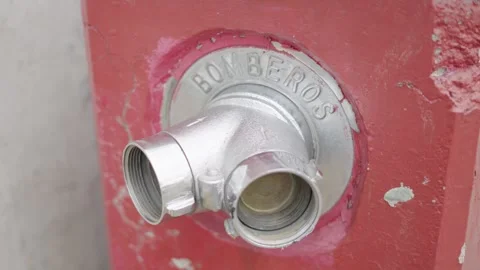 Close up of a red fire hydrant with the spanish word for firefighters, bomberos Видео 341981177