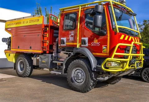 Close up of red fire trucks parked in a row at a French fire station service Stock Photos