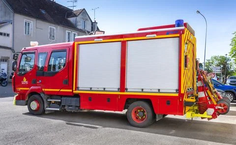 Close up of red fire trucks parked in a row at a French fire station service 库存照片