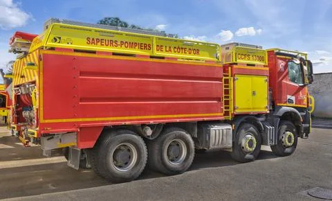 Close up of red fire trucks parked in a row at a French fire station service Stock Photos
