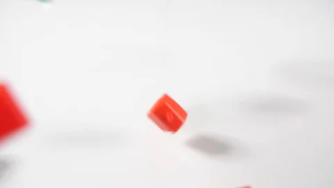Close up of red game house playing board game pieces on a white background Stock Footage 89190447