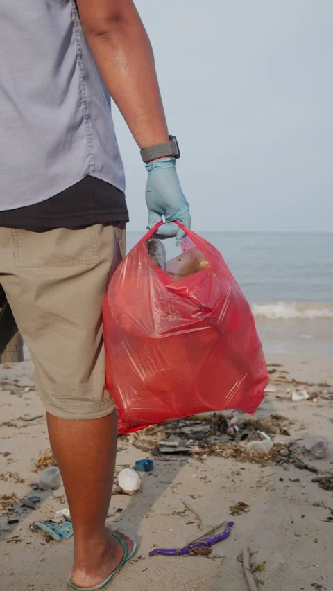 Close up of a red garbage bag filled with discarded waste Stock Footage 343574579