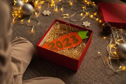 Close-up of a red gift box containing a carrot with the numbers of the New Ye Stock Photos